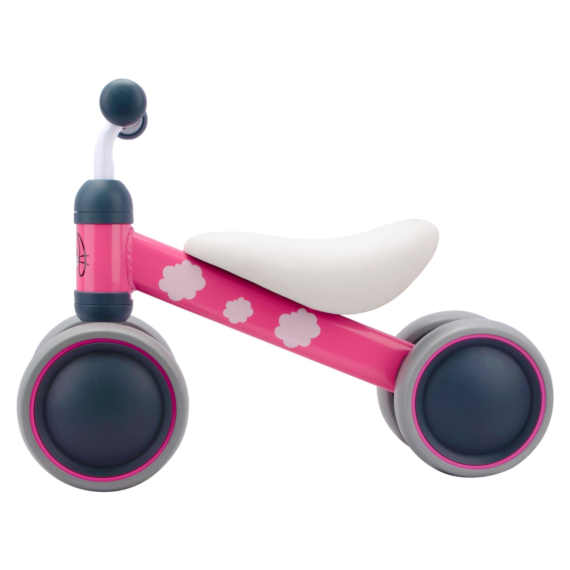 Pink balance bike with white seat and flower patterns on a white background