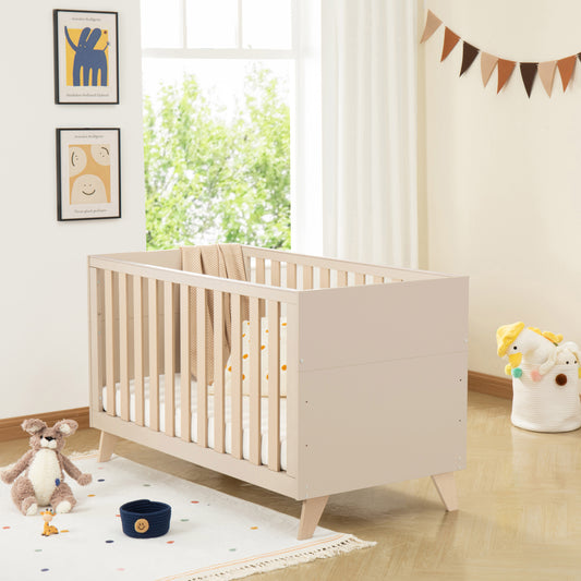 Wooden cot in a bright nursery with toys and decor