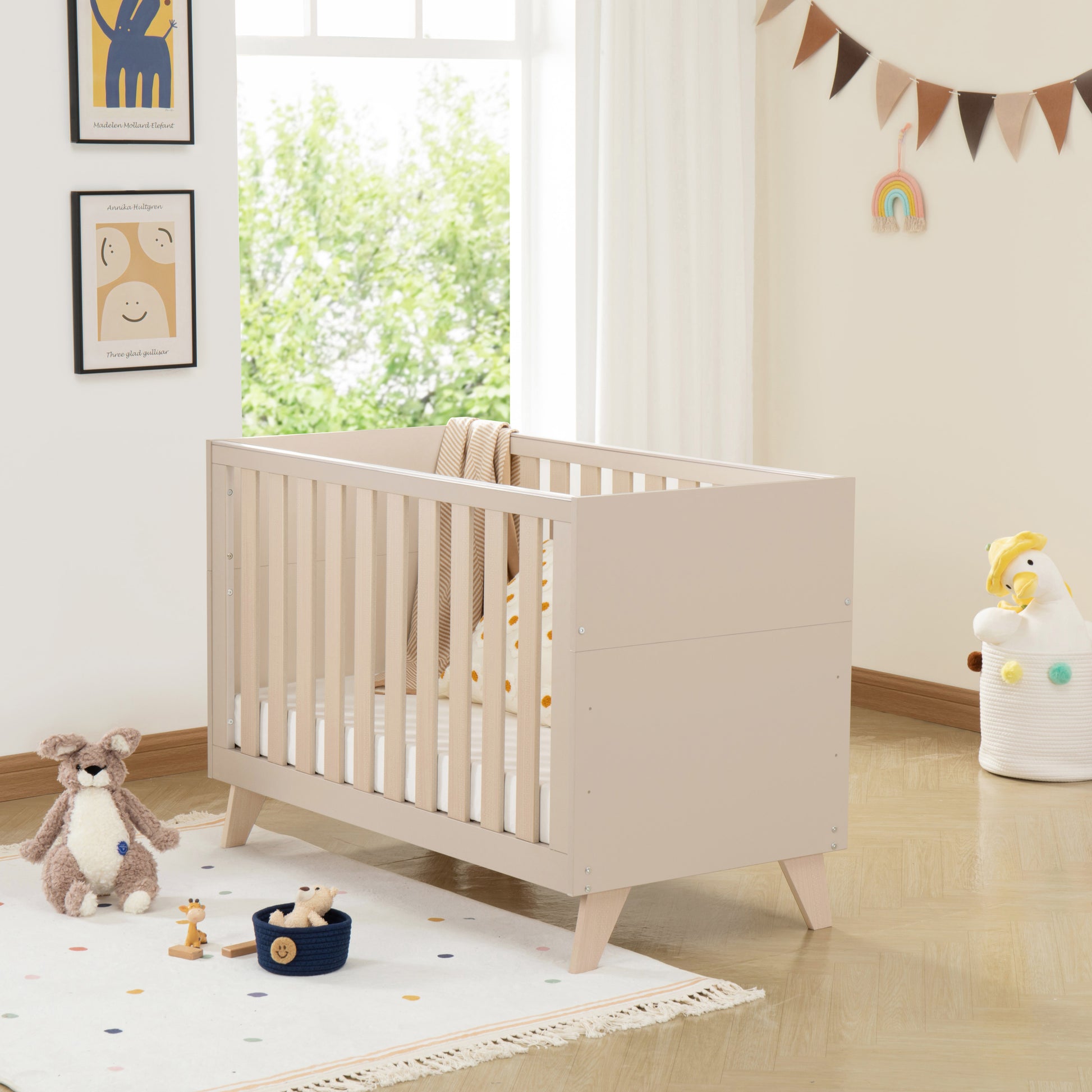 Nursery room with a cot, toys, and decorative elements.