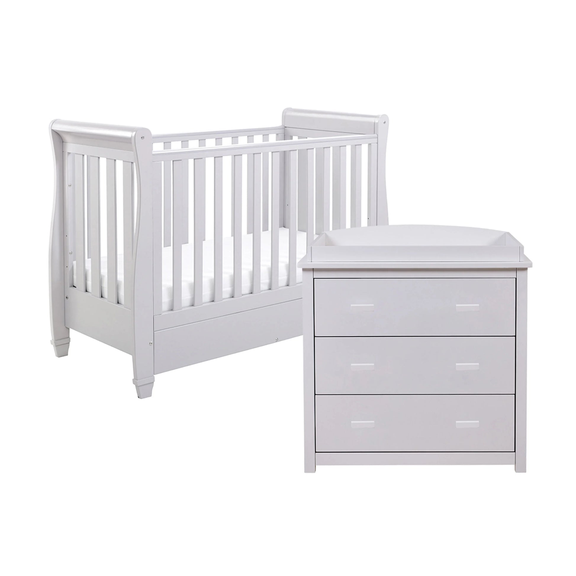 White crib and dresser set on a white background