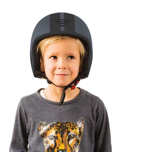 Child wearing a black helmet on a white background