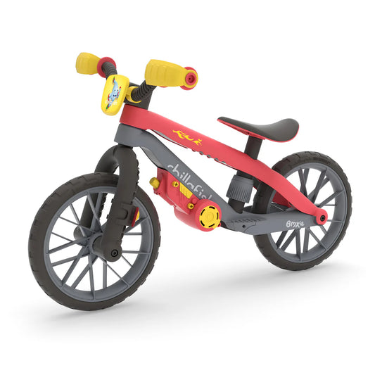 Red and gray balance bike with yellow accents on a white background
