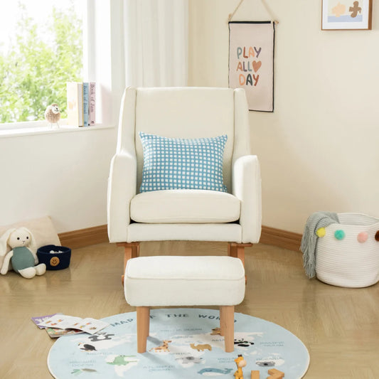 White armchair with a blue checkered pillow in a child-friendly room with toys and a rug.