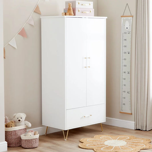 White cabinet in a child's room with toys and decor
