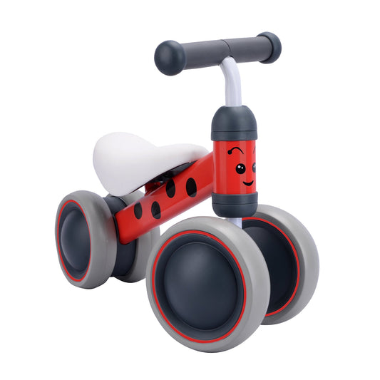 Red and gray balance bike with a smiley face on a white background