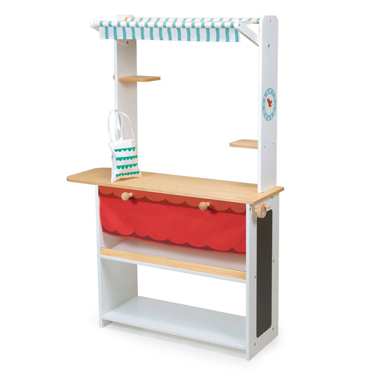 Children's play kitchen set with red storage bin and striped canopy on a white background