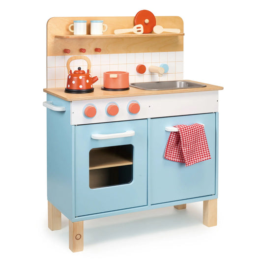 Children's wooden play kitchen set with blue base, wooden top, and colorful accessories on a white background.
