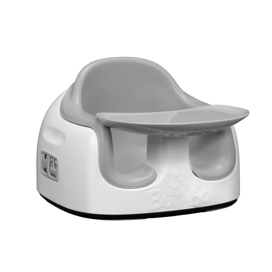 White baby seat with a tray on a white background
