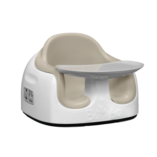 White and beige baby seat with tray on a white background