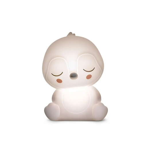 White night light shaped like a cartoon character with closed eyes on a white background