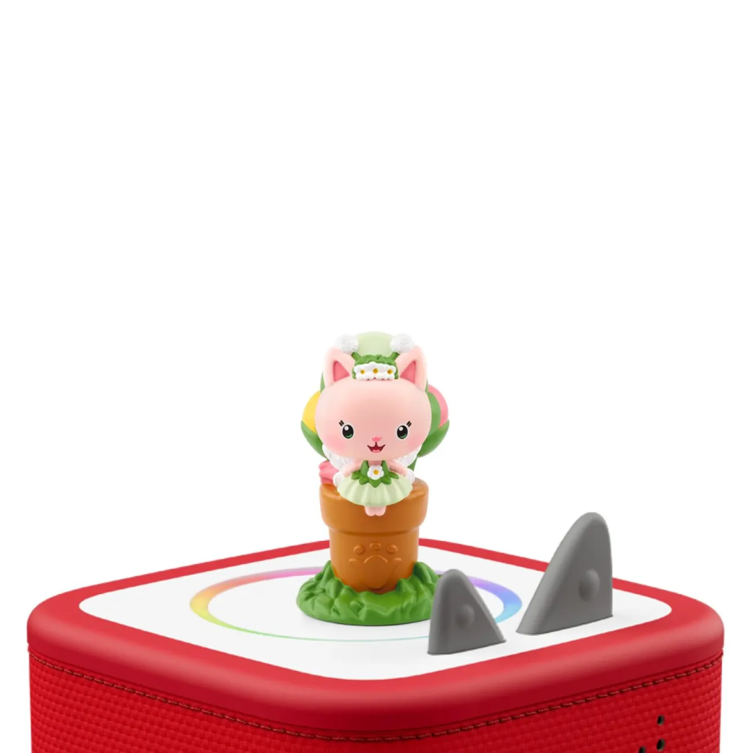 Toy figure of a pink character in a pot on a red and white base with shark fin accents.