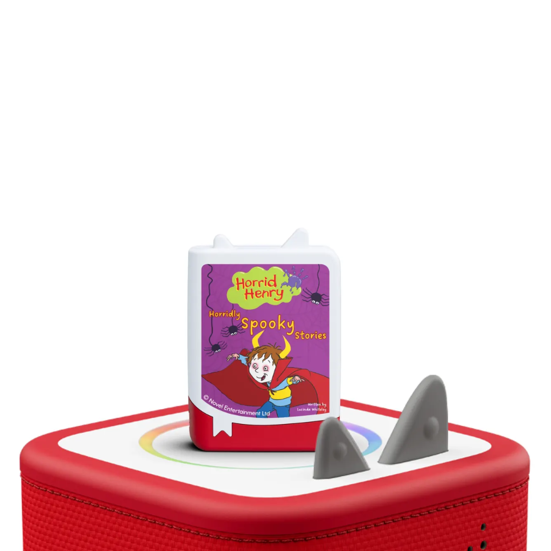 Red toy with a 'Horrid Henry' book on a white background