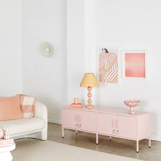 Modern living room with pink furniture and decor