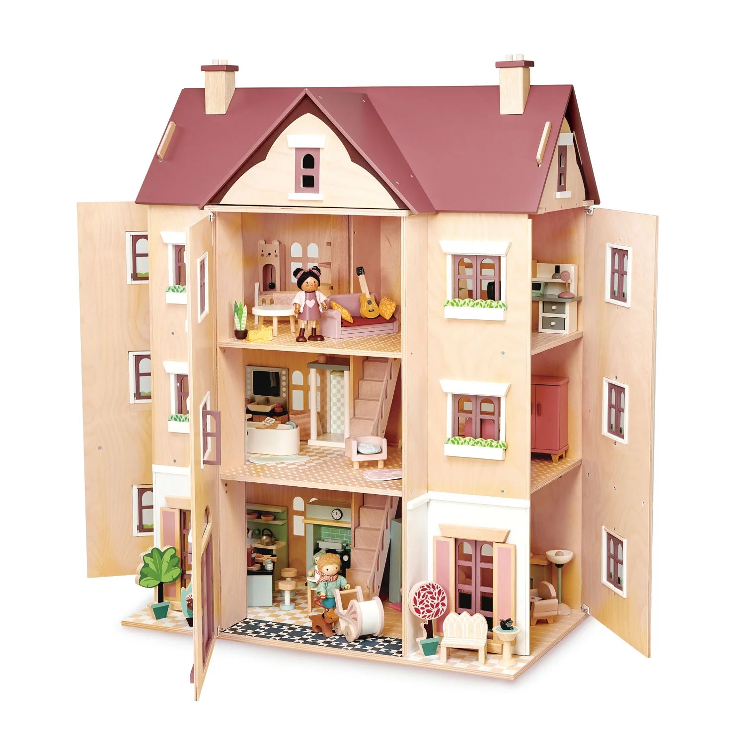 Wooden dollhouse with multiple rooms and furniture on a white background