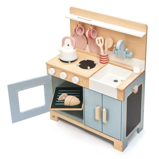 Children's wooden play kitchen set with oven, stove, and sink on a white background
