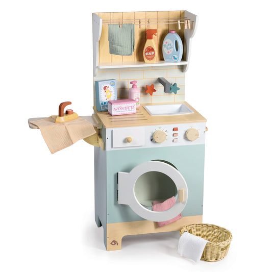 Toy laundry set with washing machine, dryer, and various items on a white background