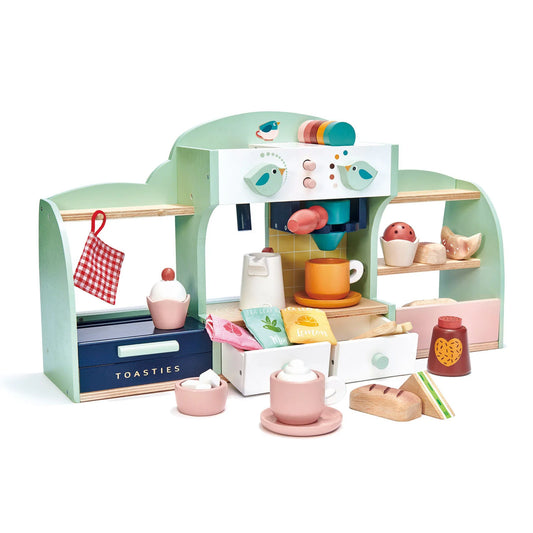 Wooden toy kitchen set with various items on a white background