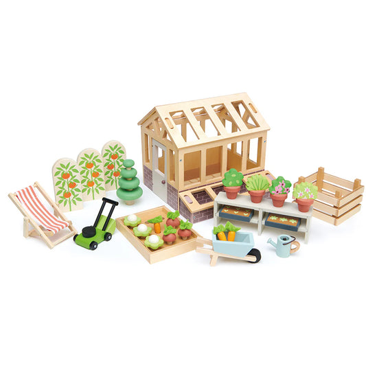 Wooden toy garden set with a greenhouse, chairs, and gardening tools on a white background