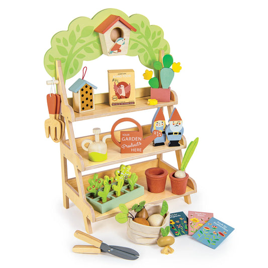 Toy garden stand with various gardening accessories on a white background