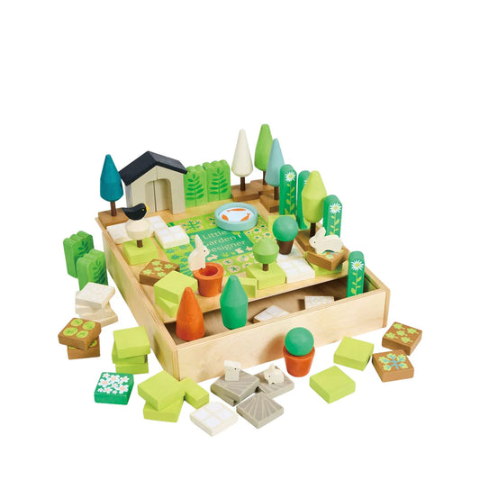 Wooden toy garden set with various pieces on a white background