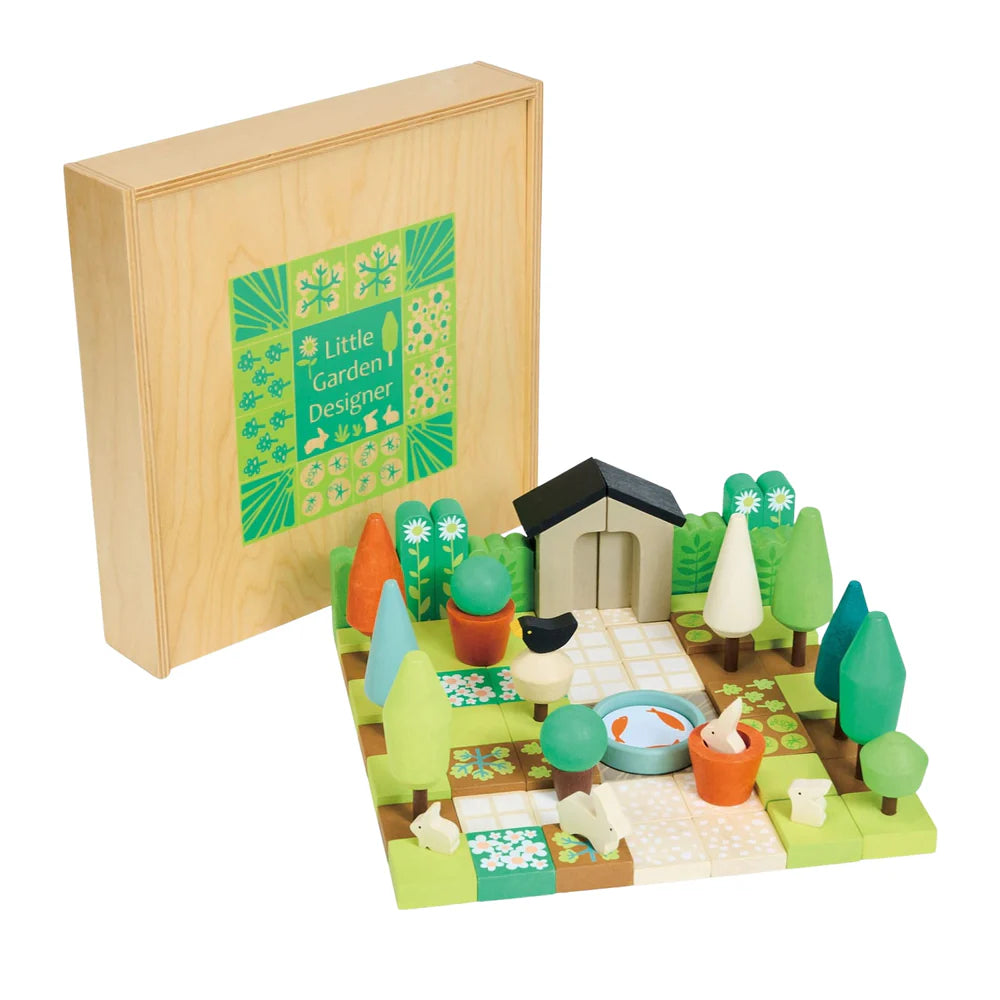 Toy garden set with wooden box labeled 'Little Garden Designer' on a white background