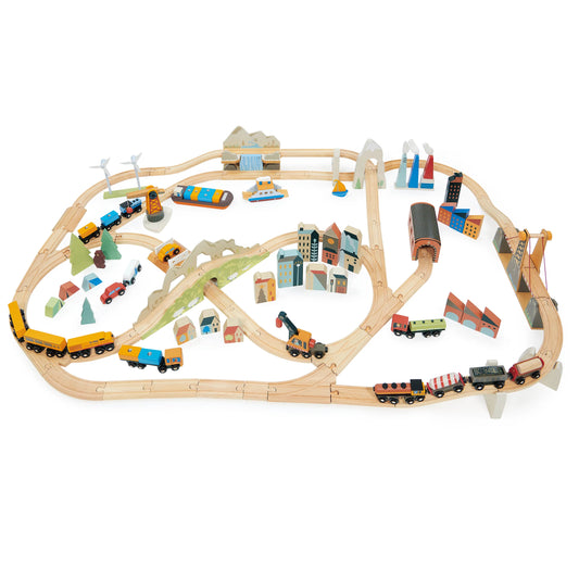 Wooden toy train set with tracks and miniature buildings on a white background