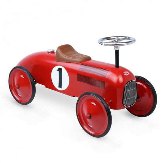 Red ride on toy car on white background