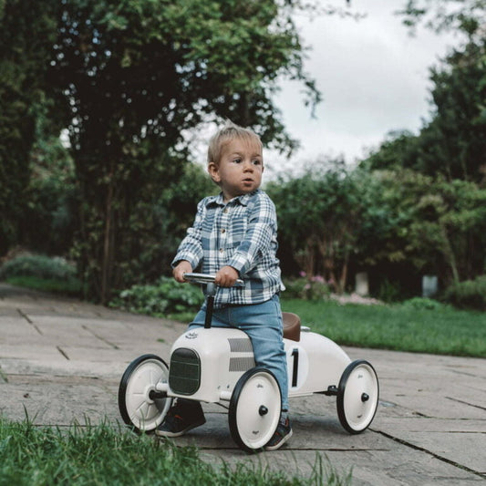 Ride on car with number 1 on the side with child riding on it