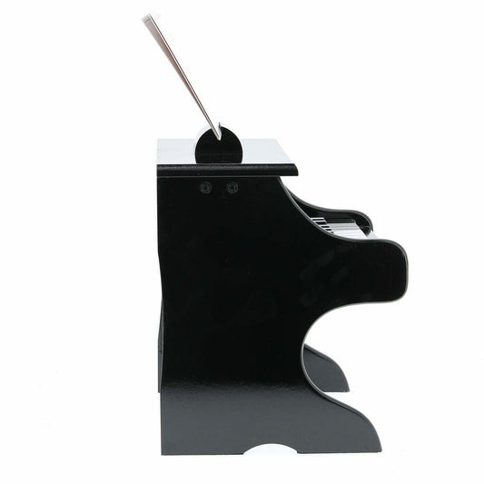 Toy piano with music stand on a white background