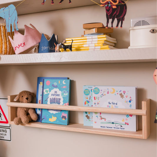 Children's room with shelves displaying books, toys, and decorative items.