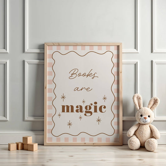 Framed poster with 'Books are magic' text on a wall with a teddy bear and wooden blocks.