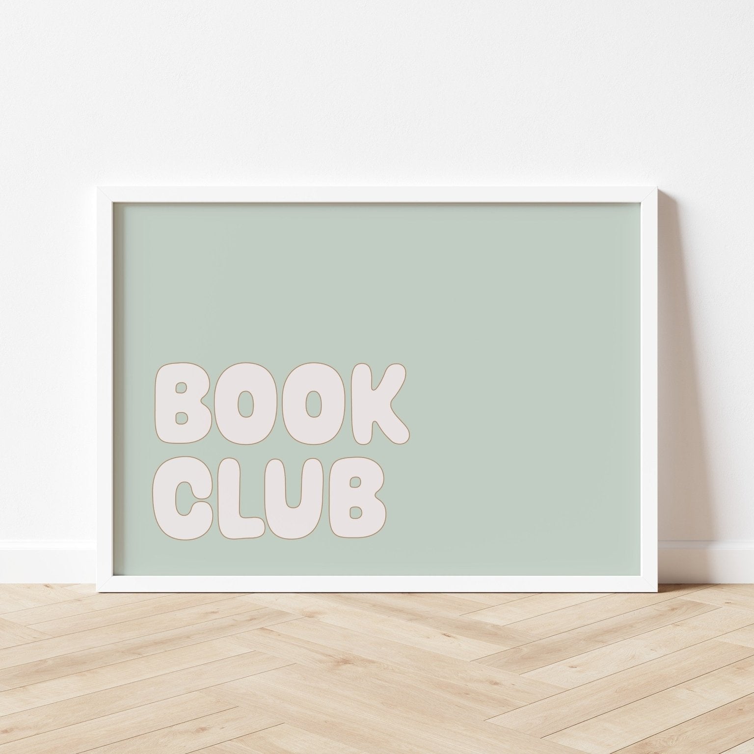 Framed poster with 'BOOK CLUB' text on a light green background