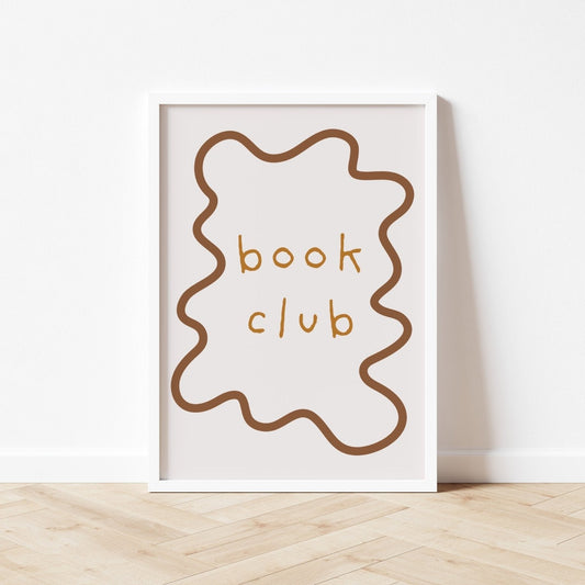 Framed artwork with 'book club' text on a white wall.