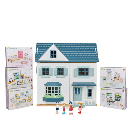 Toy house with miniature furniture boxes and figures on a gray background