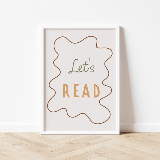 Framed poster with 'Let's Read' text on a white wall.