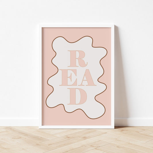 Framed artwork with 'READ' text on a pink background