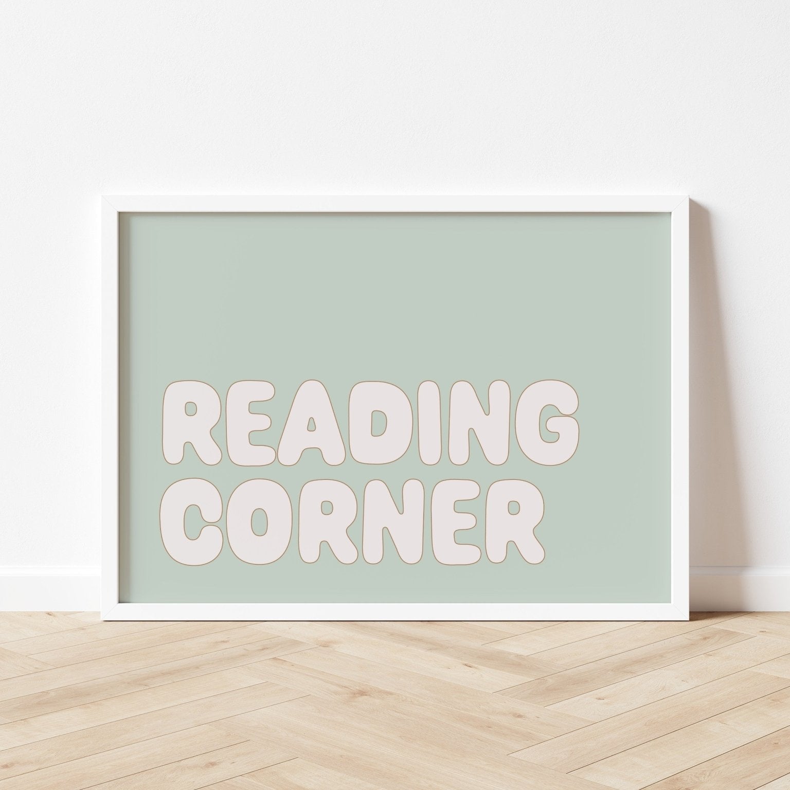Framed poster with 'READING CORNER' text on a light green background