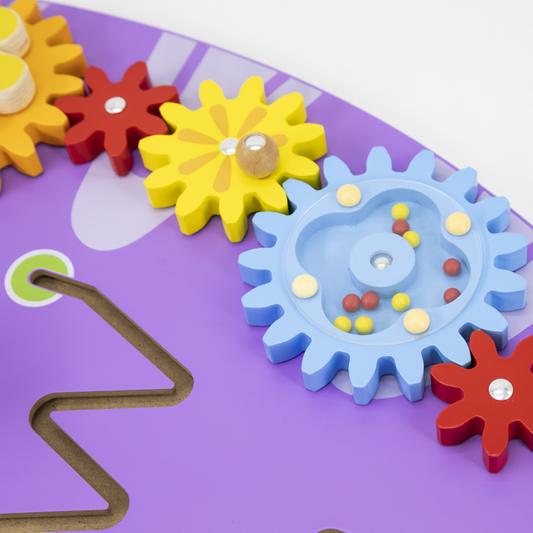 Colorful gears on a purple surface