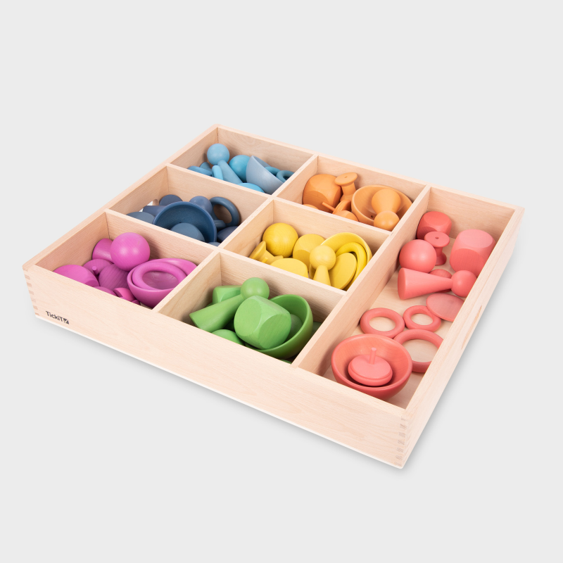 Colorful wooden shape sorting toy set in a wooden box on a light gray background