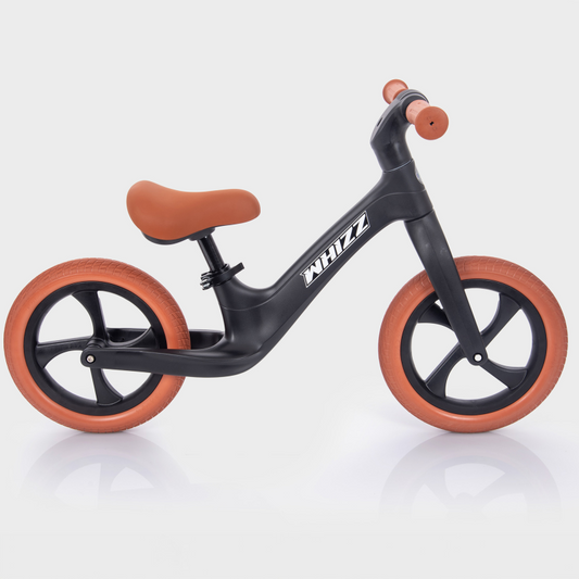 Black balance bike on a white background