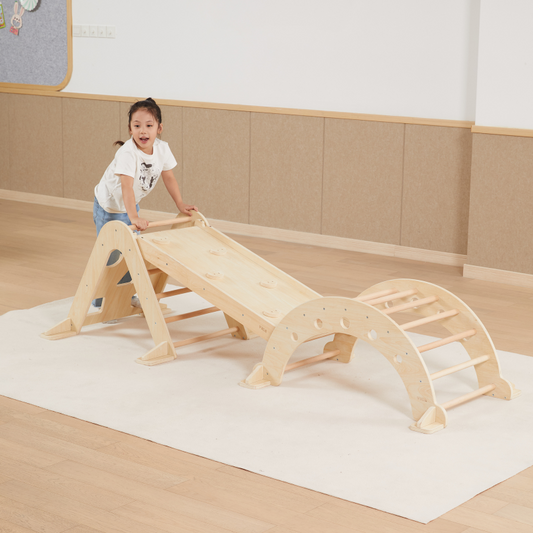 Child playing on a wooden climbing frame.