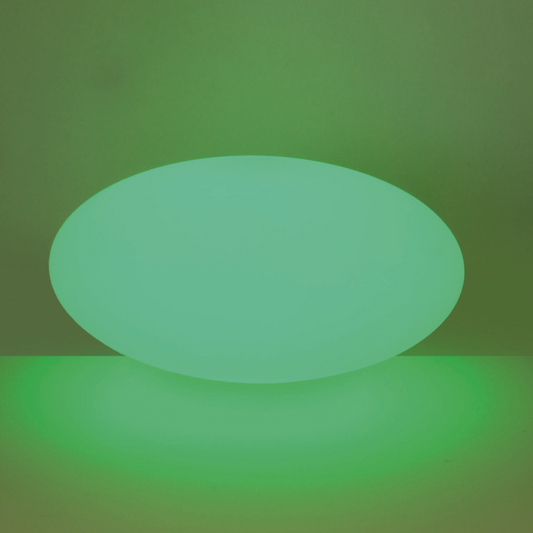 Green glowing oval shape on a green background