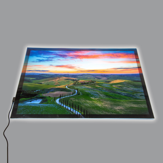 Light panel with a photo scene of hills and a winding road.