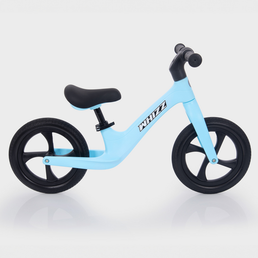 Light blue balance bike with black wheels on a white background