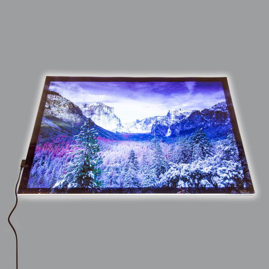 LED dlight panel showing a snowy mountain landscape play mat on a gray background