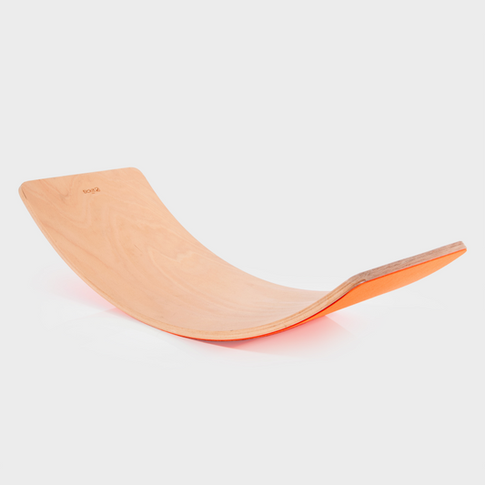 Wooden balance board on a white background