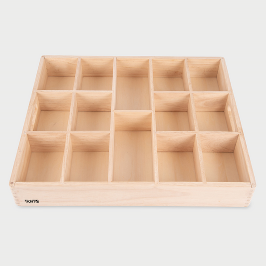 Wooden compartmentalized tray on a light gray background