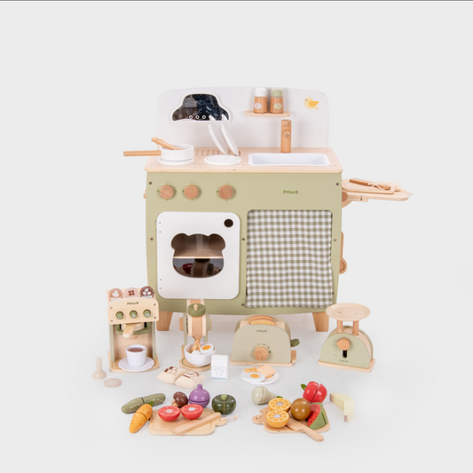 Wooden toy kitchen set with various accessories on a white background