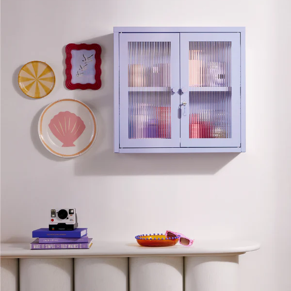 Lilac locker on wall with home decor