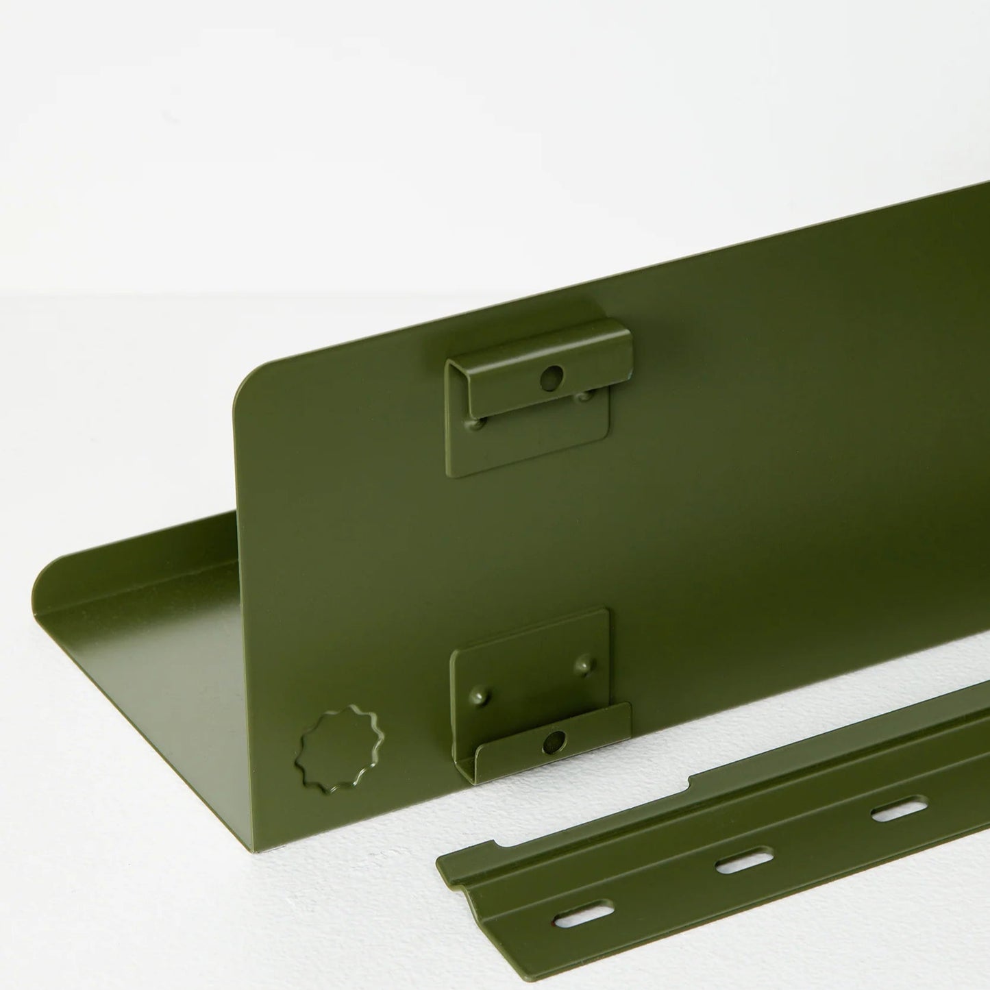 Dark green metal bracket on a white background